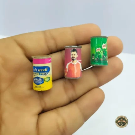 A detailed miniature health drink tin product, designed as one of many dollhouse pantry items, shown against a clean, well-lit background.