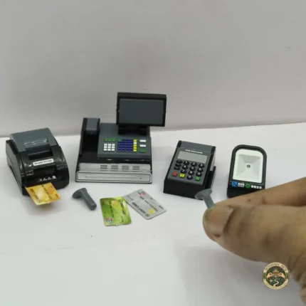 A detailed dollhouse cash register set product, showcasing its vintage design with intricate keys and a small cash drawer.