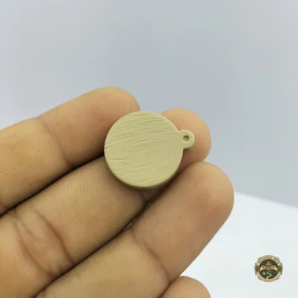 A wooden miniature cutting board product showcasing its wood grain and surface for dollhouse kitchen displays.