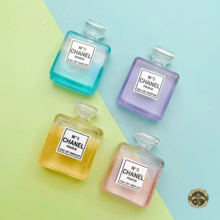 A decorative miniature perfume set product displaying several unique, vintage-style glass bottles with ornate stoppers on a clean surface.