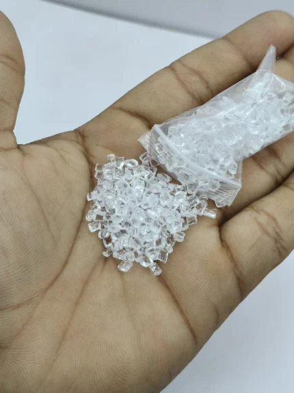 A packet of realistic miniature ice cubes product showing the small, clear, and irregularly shaped pieces ideal for dollhouse drinks.