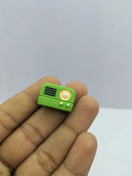 A detailed miniature retro radio product with a brown wood-grain finish and silver tuning dials, designed for 1:12 scale dollhouses.