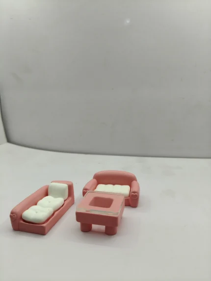 A detailed dollhouse miniature sofa set product with realistic fabric upholstery, shown as a centerpiece for a tiny living room display.