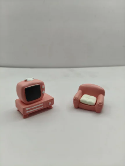 A detailed miniature TV unit set product showing a modern flat-screen television on a sleek wooden stand for dollhouse living rooms.