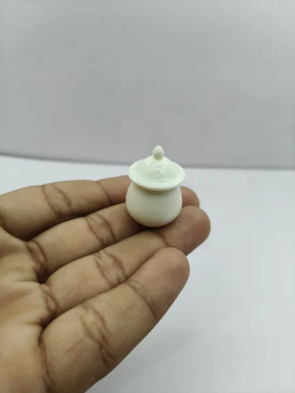 A detailed miniature white ceramic jar product with a glossy finish and matching removable lid, shown on a neutral background for crafting.