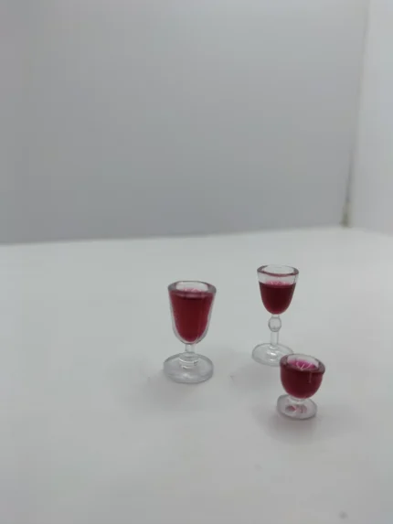 A realistic dollhouse wine glass product showcasing its crystal-clear material and classic tulip shape on a background.