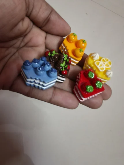 A highly detailed, realistic miniature bite cake product, perfectly scaled for dollhouse kitchens or displays.