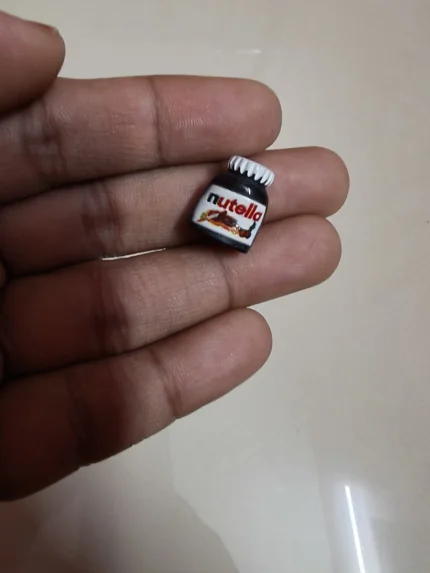 Highly detailed miniature Nutella jar, a tiny chocolate spread product for dollhouse kitchens and food dioramas.