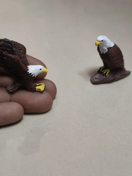 A stunning, highly detailed eagle miniature set product, showcasing realistic feathers and majestic poses.