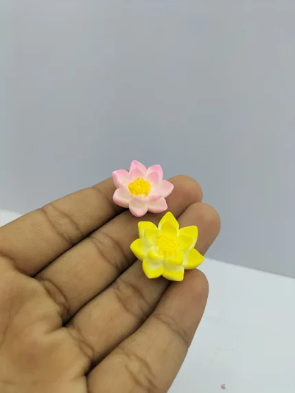 A beautifully detailed lotus flower miniature product, showcasing delicate pink and white petals and a vibrant yellow center for dioramas.
