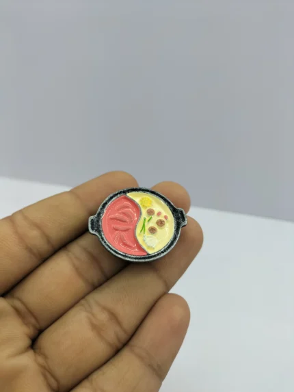 A white ceramic dollhouse soup bowl product, showcasing its glaze and 1:12 scale for miniature kitchen scenes.