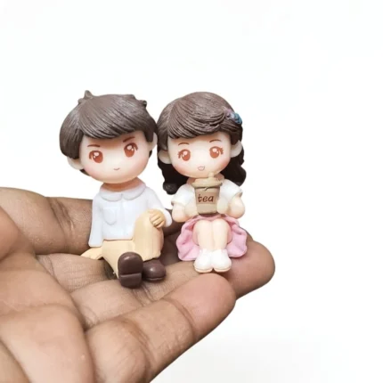 Anime style sitting couple miniature figurine set of 2, a delightful product for collectors and enthusiasts.