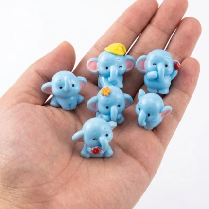 Charming blue baby elephant miniature figurine, randomly selected, a collectible product on white background.