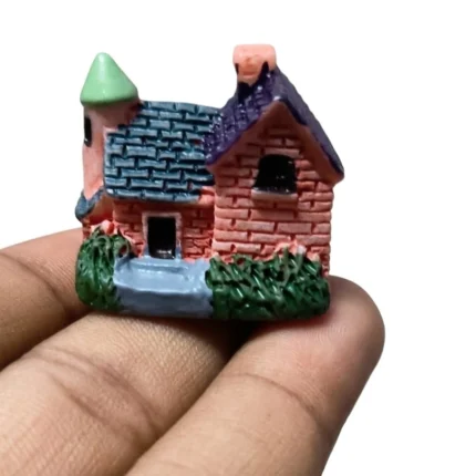 A detailed resin miniature brick house product featuring a charming turret, perfect for fairy gardens or display.