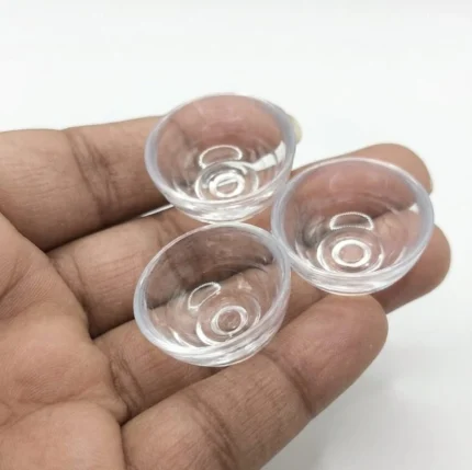 Clear miniature plastic bowl lens dome product, versatile for dollhouse scenes and DIY projects.