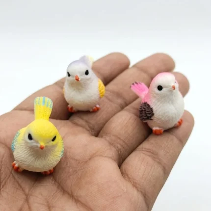 Vibrant, randomly selected miniature bird figurine product with intricate details and bright colors.