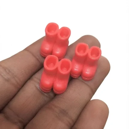 Coral pink miniature rain boots product, ideal for dollhouses, dioramas, or tiny displays.