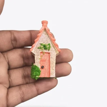 Coral roof stone resin cottage figurine product with intricate details for miniature display or fairy garden.