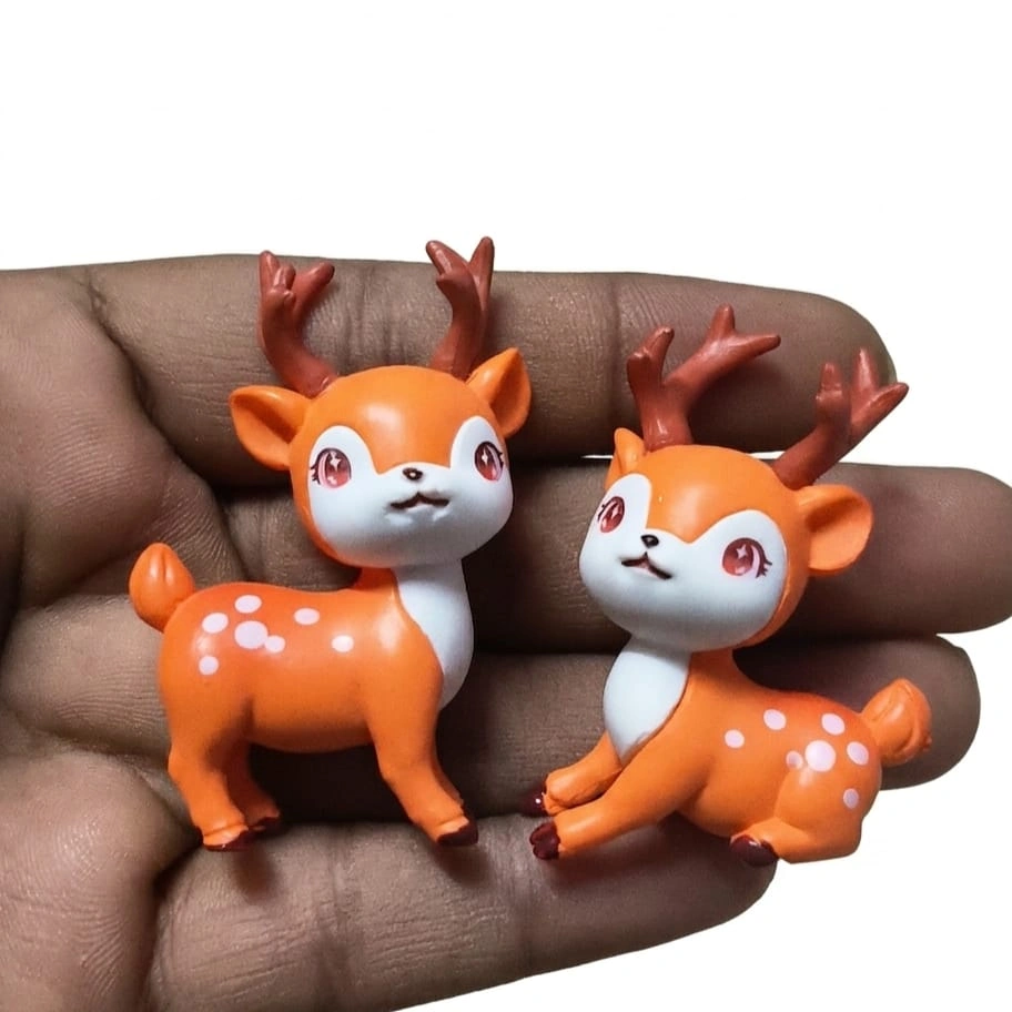 Deer-Fawn-Miniature-Figurine A charming set of two miniature deer fawn figurines, showcasing the intricate detail of this delightful product.