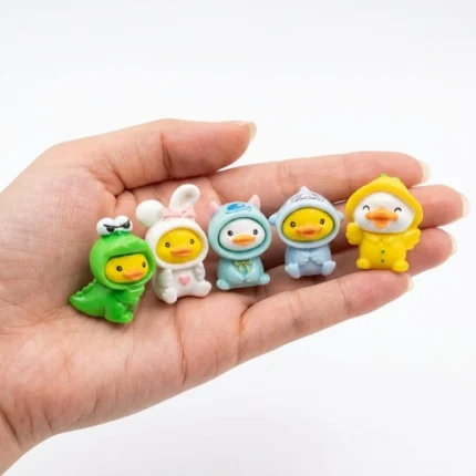 A charming resin duck figurine product in a random, adorable costume, perfect for miniature collectors and display.