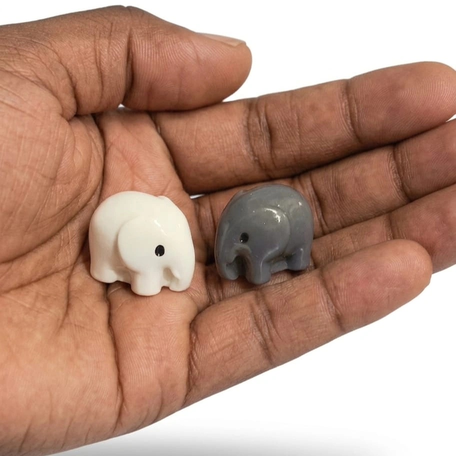 Elephant-Miniature-Figurine A charming white and grey elephant miniature figurine set of two, this product is perfect for collectors.