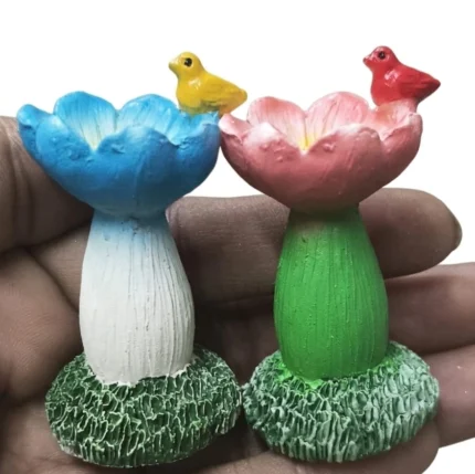 Miniature flower birdbath product with a tiny bird figurine, perfect for miniature gardens or dollhouse scenes.