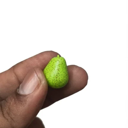 Detailed green speckled pear miniature product for dollhouse scenes and miniature food displays.