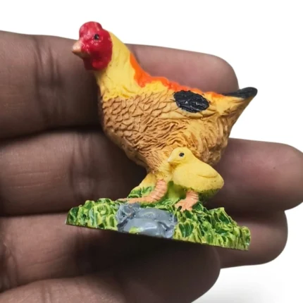 Hen with Chick Resin Miniature Figurine product, a charming farm animal detail for display or collection.
