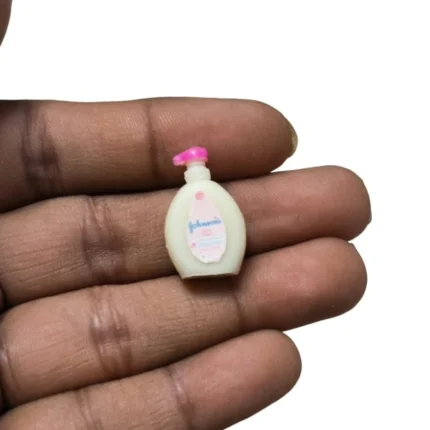 Highly detailed Johnson's Baby Lotion pump bottle dollhouse miniature product for tiny nursery scenes.