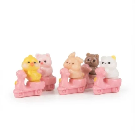 A delightful random kawaii animal figurine product, featuring a cute creature on a vibrant pink scooter miniature.