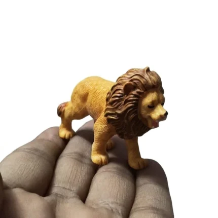 Detailed miniature lion animal figurine product, handcrafted for collectors, showcasing intricate features.