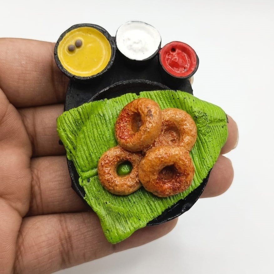 Medu-Vada-with-Sambar-and-Chutney-Miniature-Fridge-Magnet This unique medu vada miniature magnet product features a South Indian breakfast with sambar and chutney.