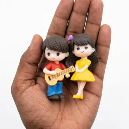 Miniature couple figurine product with guitar boy serenading girl, perfect for dollhouses or unique gifts.