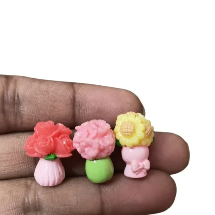 Product image of three miniature flower vases, intricately designed, perfect for dollhouse or diorama scenes.