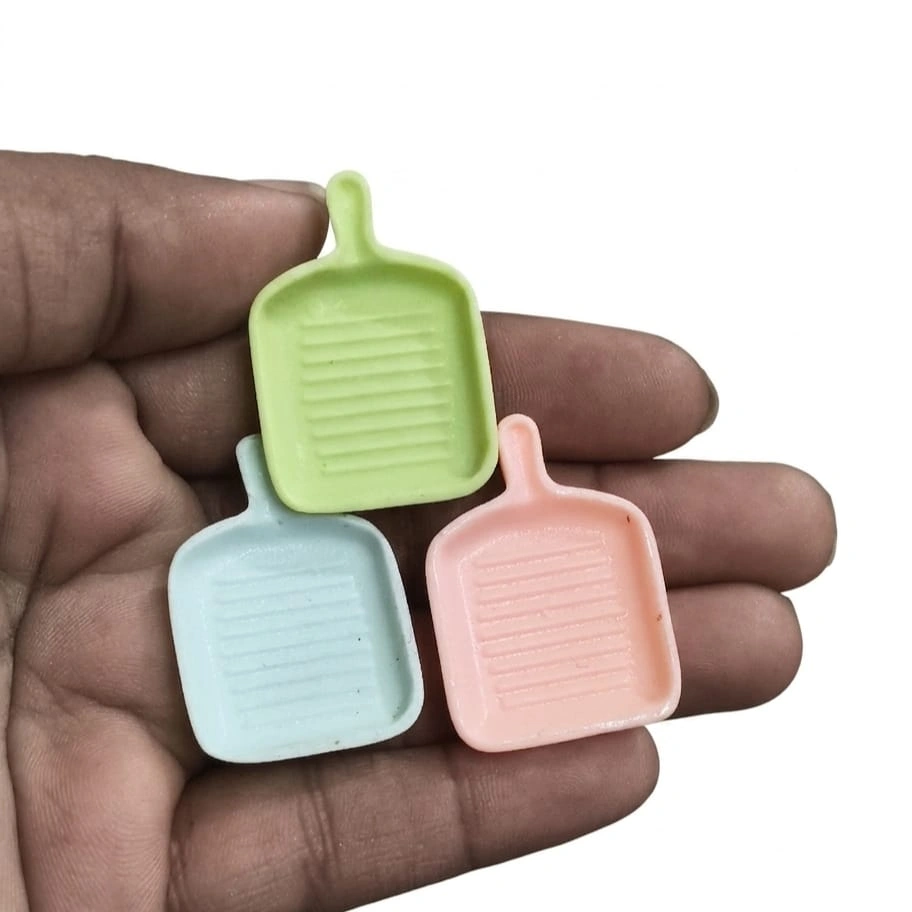 Miniature-Grill-Pan-Pastel-Colors-Dollhouse-Kitchen Charming miniature plastic grill pan in pastel colors, perfect for dollhouse kitchen product scene.