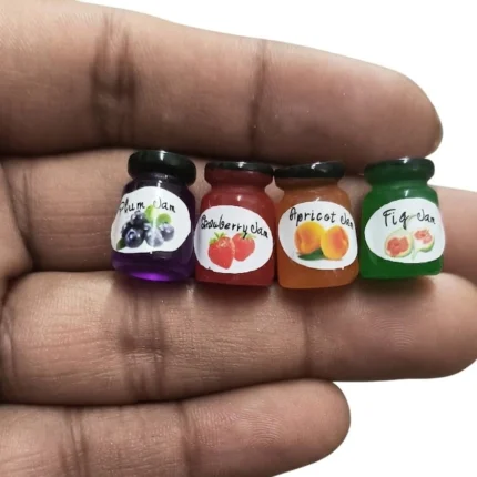 Product: Set of four miniature jam jars, perfect for dollhouse kitchen scene with realistic detail.