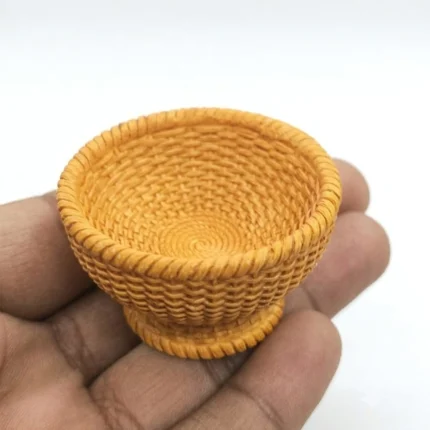 A finely crafted miniature woven basket bowl, a realistic dollhouse accessory product perfect for tiny scene decor.