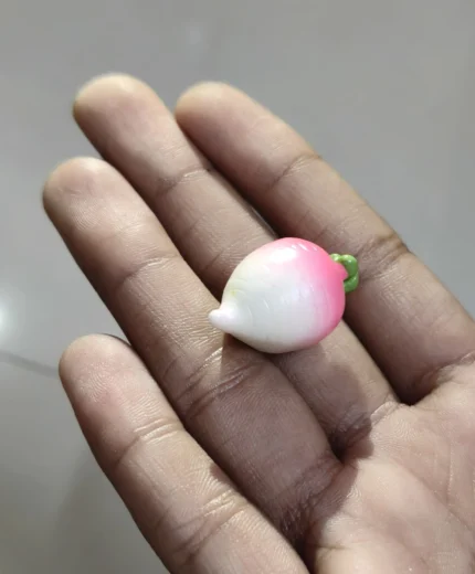 Realistic miniature pink radish vegetable figurine product for dollhouse kitchens, miniature gardens, or dioramas.