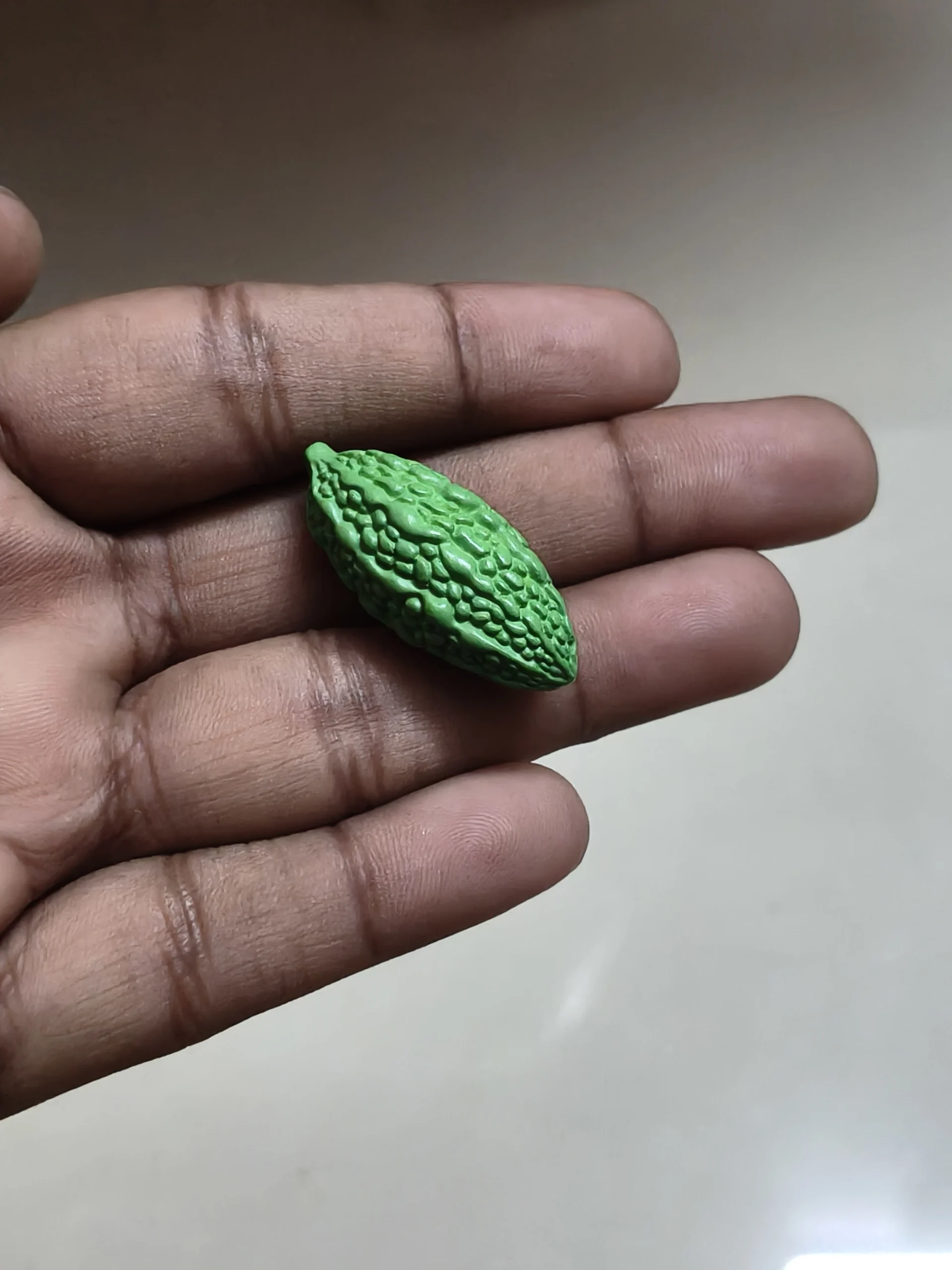 Miniature-fruits-and-vegetables-11 Highly detailed, realistic miniature bitter gourd figurine product for dollhouse scenes, dioramas, display.