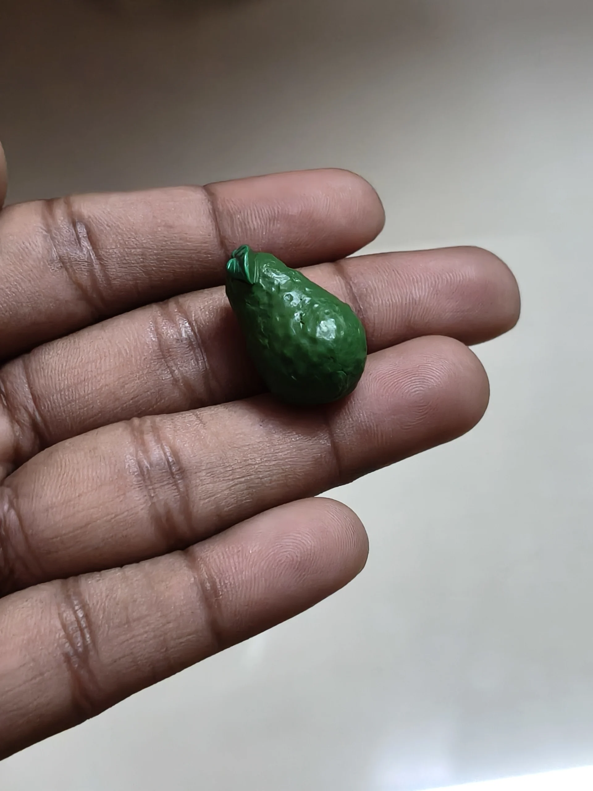 Miniature-fruits-and-vegetables-18 Detailed, realistic miniature bitter gourd figurine product for dollhouse kitchens and miniature food displays.