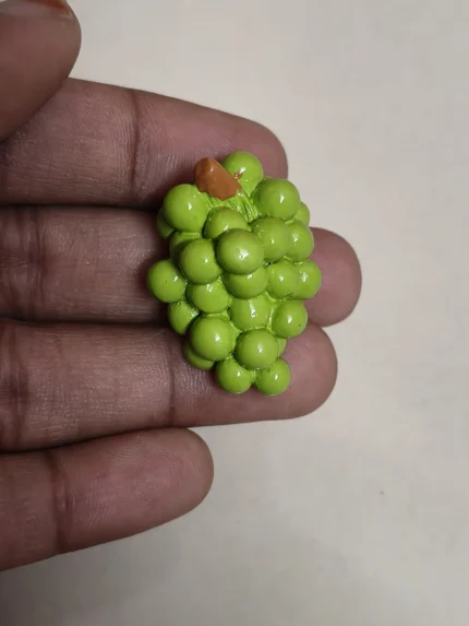 Highly detailed and realistic miniature green grapes cluster figurine product, ideal for dollhouse food displays.