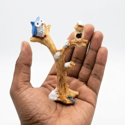 Charming resin product: owl on snow-dusted winter tree with birdhouse, ideal for miniature scenes.