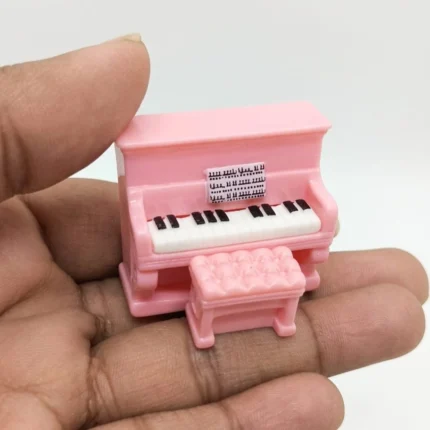 Pink miniature piano with bench dollhouse furniture product, a charming addition for any miniature scene.