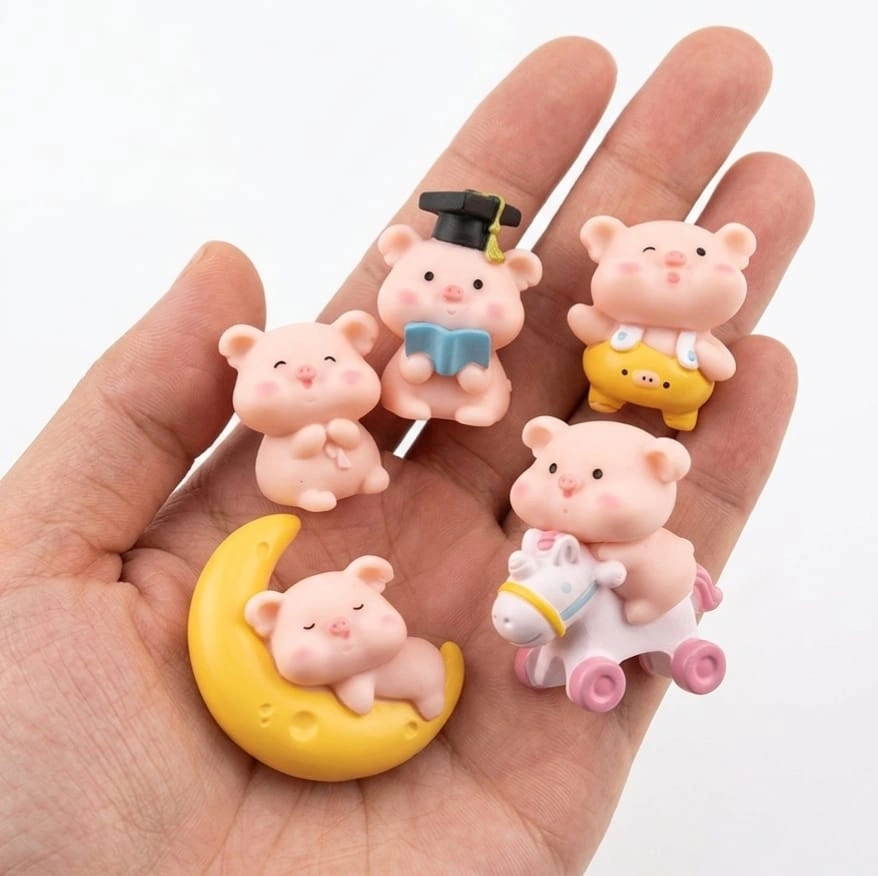 Pink-Pig-Miniature-Figurine Charming pink pig miniature figurine, a delightful collectible product for dollhouse scenes and displays.
