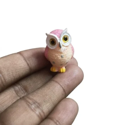 Pink resin miniature owl figurine product, perfect for whimsical display or collection.