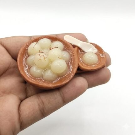 Miniature rasgulla in terracotta bowl fridge magnet product, detailed Indian sweet replica.