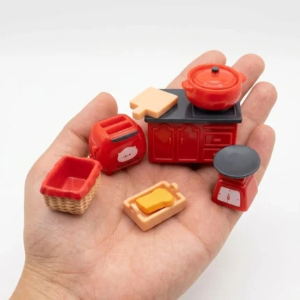 A delightful product, a miniature red kitchen accessories set, perfect for dollhouse scenes and collectors.