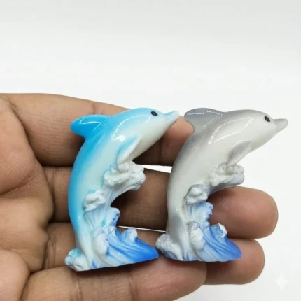 A beautifully crafted resin dolphin miniature figurine, showcasing the intricate details of this charming product.