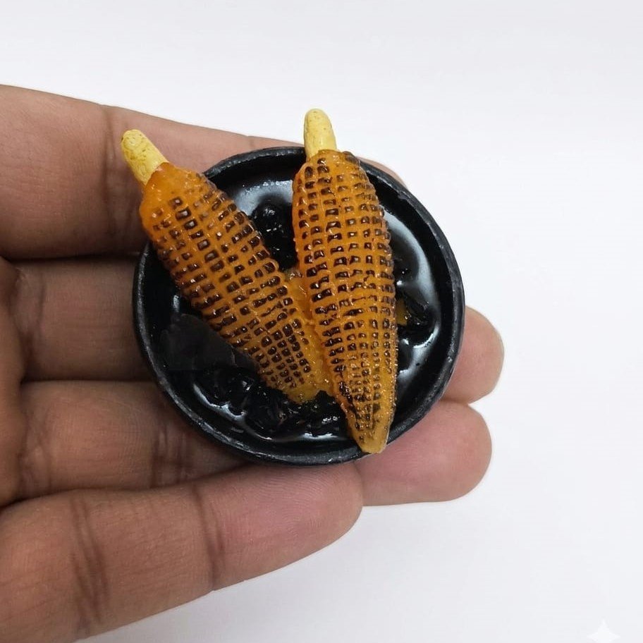 Roasted-Corn-on-Tawa-Miniature-Fridge-Magnet Highly detailed, handcrafted miniature roasted corn on tawa fridge magnet product, ideal for food enthusiasts.