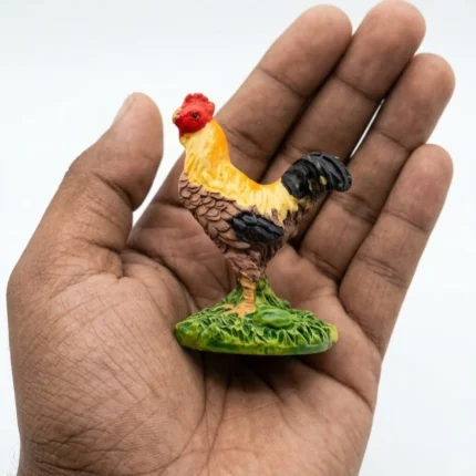 A vibrant, hand-painted resin rooster miniature figurine, showcasing intricate details of the farm animal product.